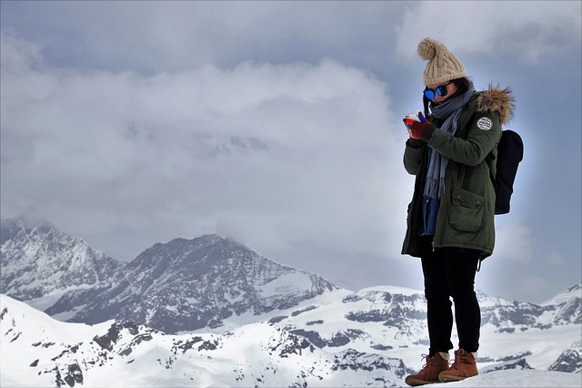 Woman hiker looking at phone app to help with navigation.