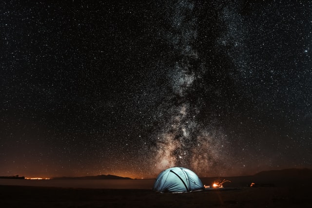 A tent under a sky full of stars.
